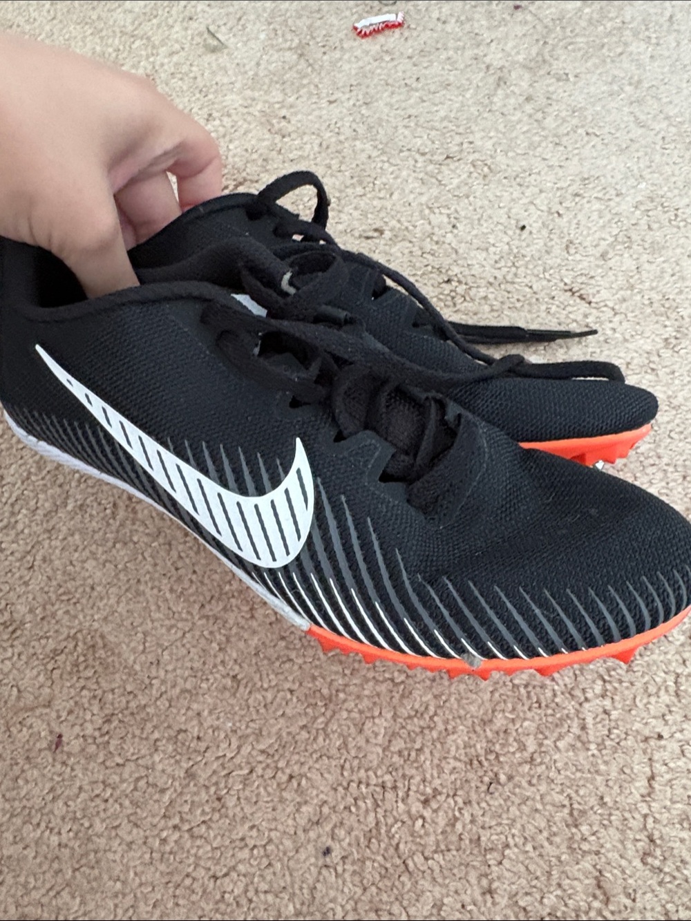 Nike Black Track Spikes with White Swoosh and Orange Soles